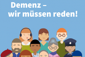Eine vielfältige Gruppe von Menschen steht zusammen und zeigt Unterstützung für den Welt-Alzheimer-Tag mit dem Motto „Demenz – wir müssen reden!“.